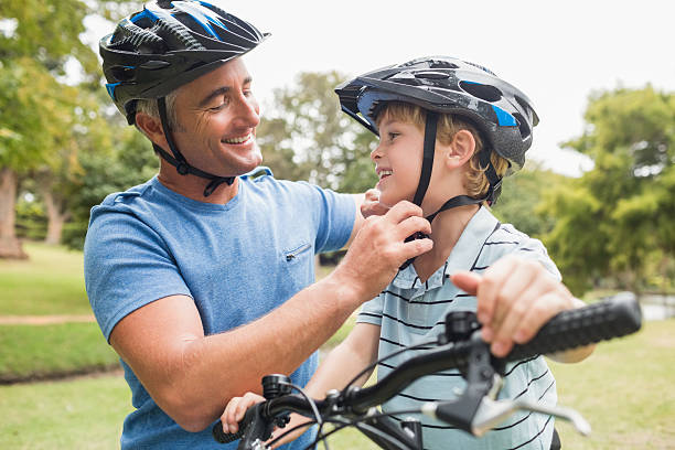 istock Happy father on a bike with his son 481727288