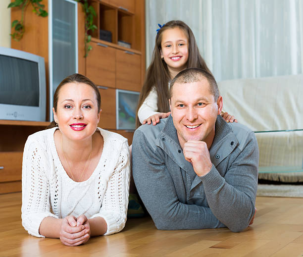 istock Family smiling at the floor 481727790