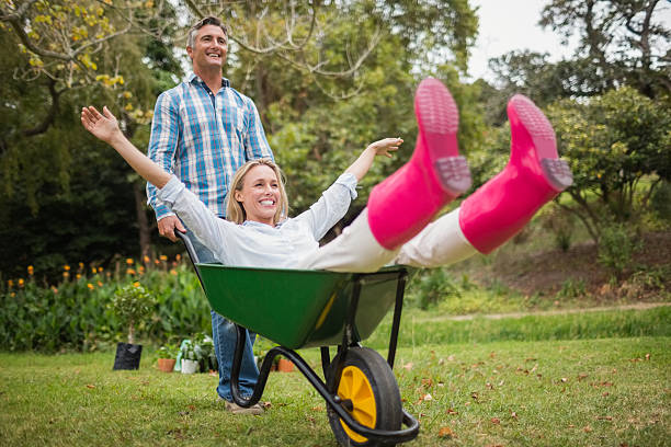 istock Happy couple playing with a wheelbarrow 481728040