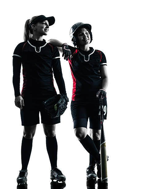 istock women playing softball players silhouette isolated 481728348