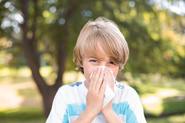 istock Little boy blowing his nose 481729098