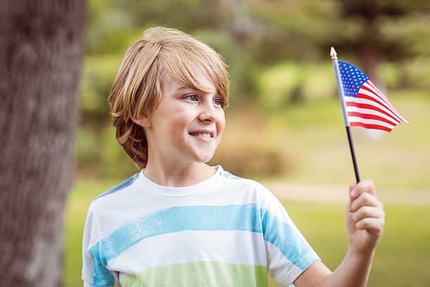 istock Young boy holding an american flag 481729158