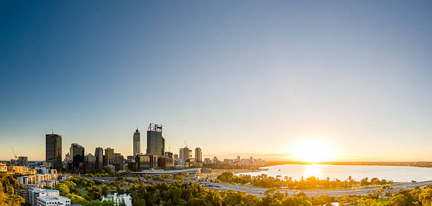Sunrise in Perth Panorama Just after sunrise, light bursts from the horizon and brings a new day to Perth. perth australia photos stock pictures, royalty-free photos & images