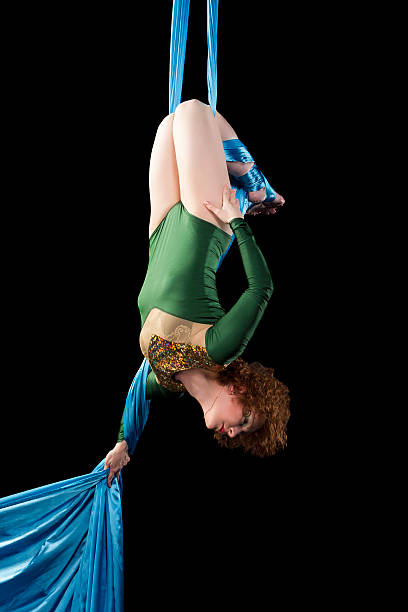 istock Young gymnast doing exercise on aerial silks 481730412