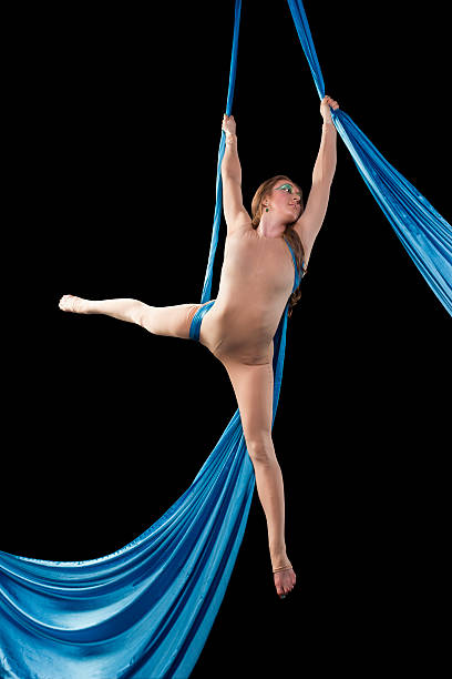 istock Young gymnast doing exercise on aerial silks 481730416
