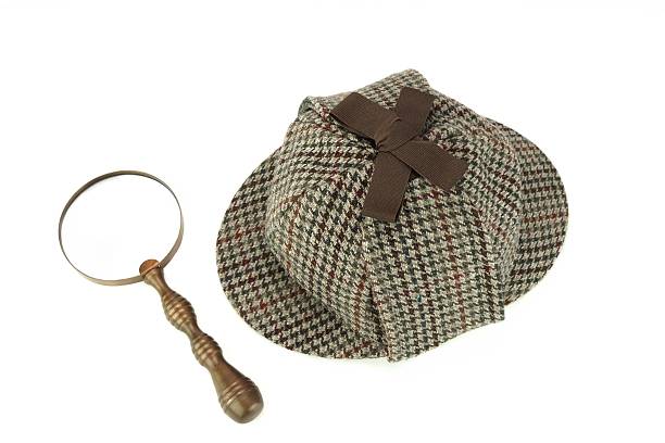 istock Deerstalker Cap And Vintage Magnifying Glass Isolated 481730676
