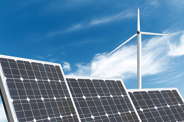 istock solar energy panels and wind turbine 481731400