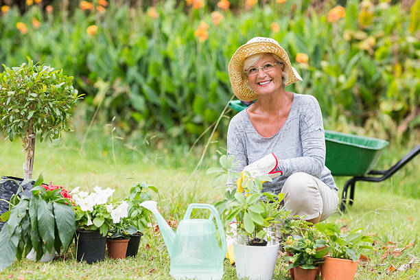 istock Happy grandmother gardening 481731720