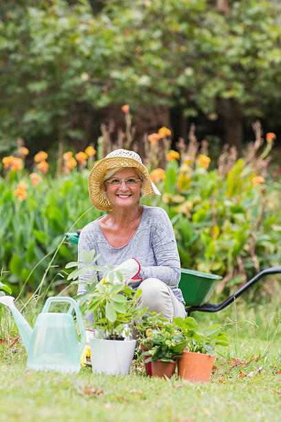 istock Happy grandmother gardening 481731744
