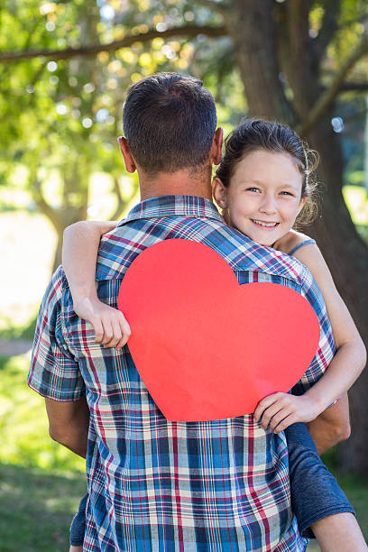 istock Father and daughter hugging in the park 481735026