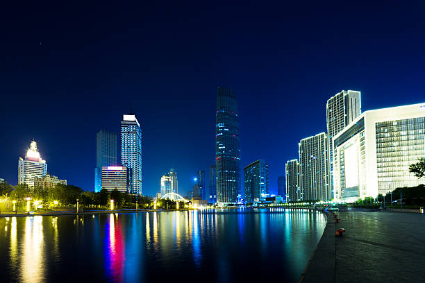 istock Illumintaed modern skyscrapers and skyline at riverbank 481735258