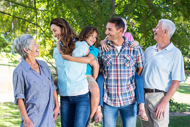 istock Extended family smiling in the park 481735818