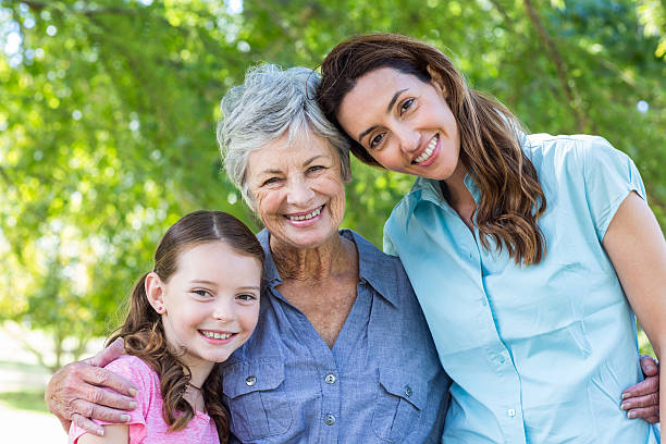 istock Extended family smiling in the park 481738490