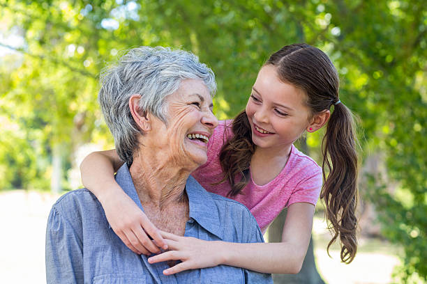 istock granddaughter and grandmother smiling 481738556