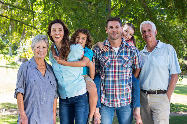 istock Extended family smiling in the park 481739692