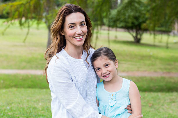 istock Happy mother and daughter smiling at the camera 481742348