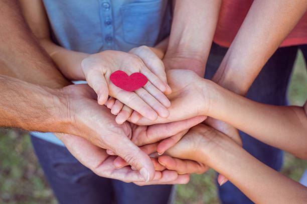 istock Friends holding a heart 481742534