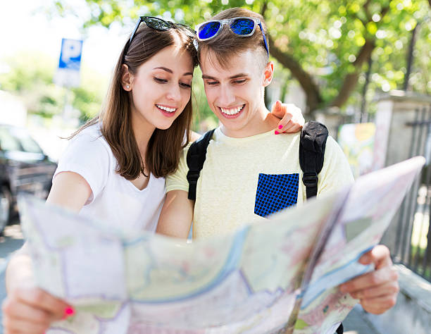 istock Couple of tourists looking at map 481742872