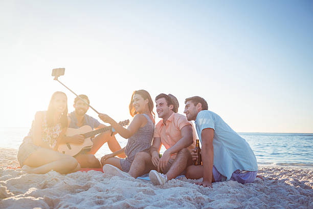 istock Happy hipsters taking pictures with selfie stick 481743732