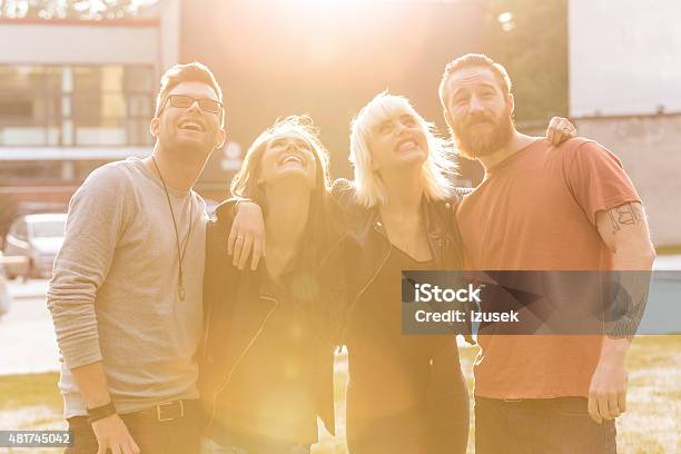 Happy Friends Outdoor At Sunset Stock Photo - Download Image Now - 20-24 Years, 2015, Adult