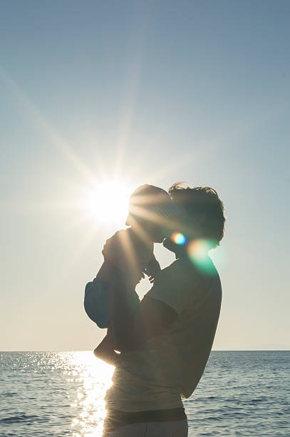 istock Father and baby on the beach 481745266