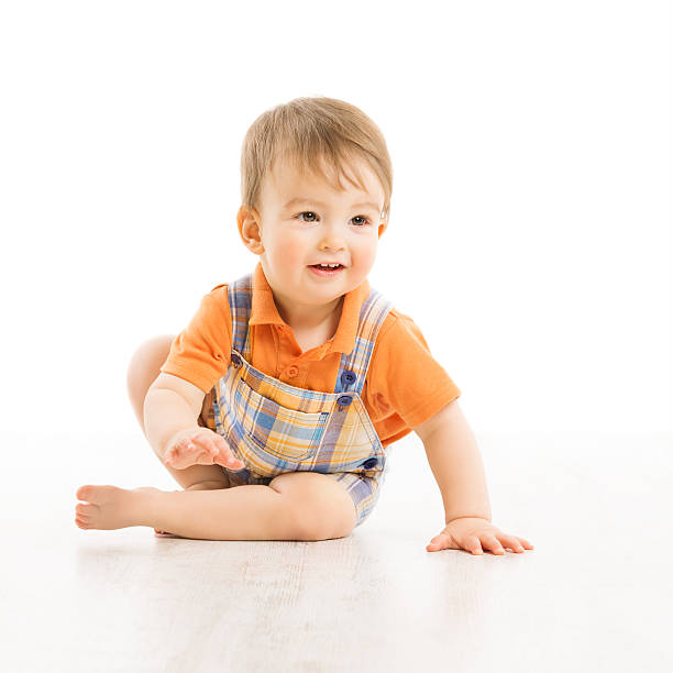 istock Child happy smiling, small one year boy crawling over white 481748735