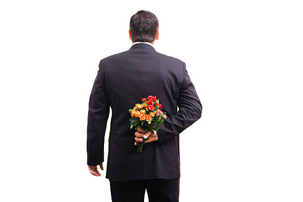 istock Man in suit with flowers 481749333