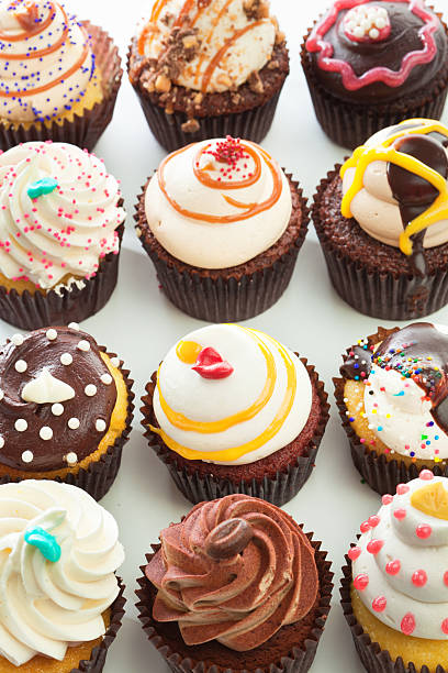 istock Group of Fancy Goumet Cupcakes on White Background Vt 481749573