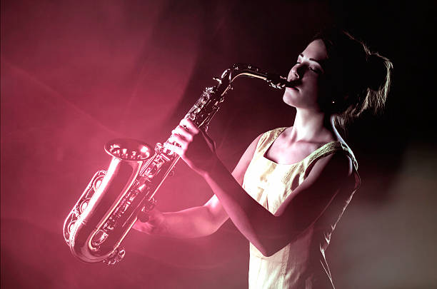 Young Woman Playing Saxofone on Stage Lights