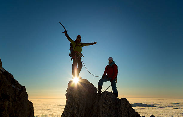 istock Climbers standing on rock and celebrating 481754900