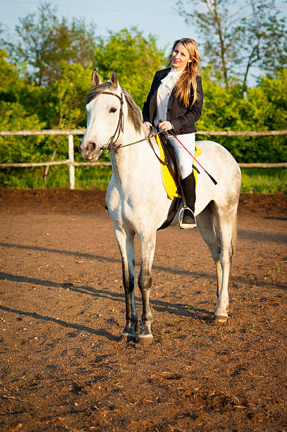 istock Horsewoman at hippodrome and blue sky 481755286