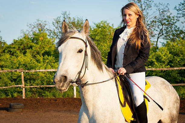 istock Horsewoman at hippodrome and blue sky 481755290