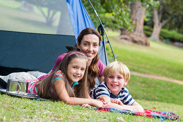 istock mother and children having fun in the park 481756080