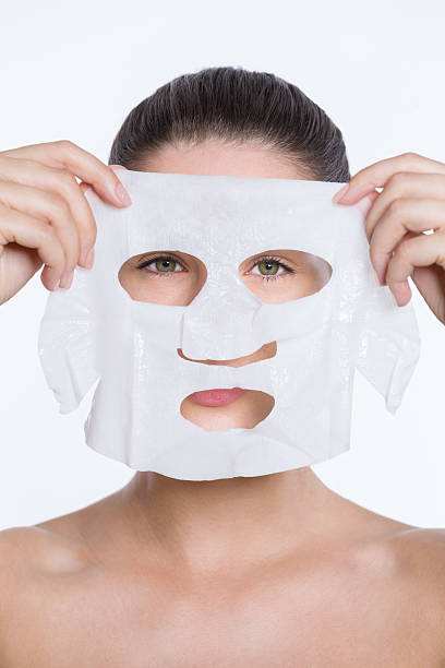 istock Woman applying beauty face mask 481756484