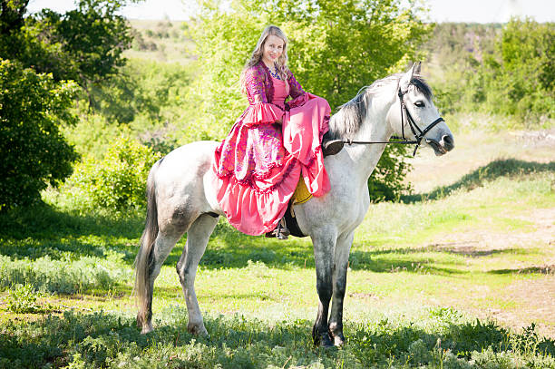 istock Horsewoman on white horse 481757532