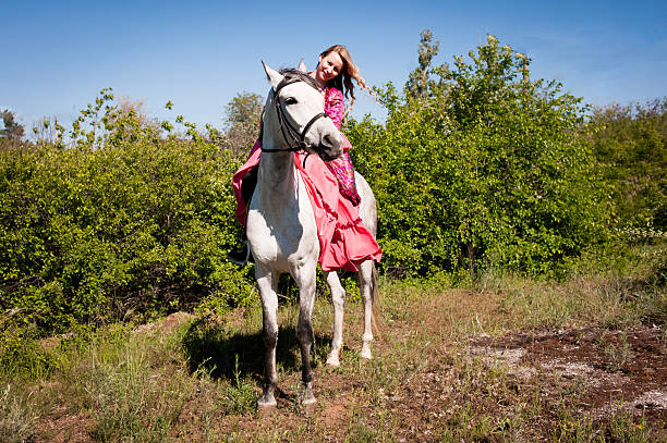 istock Horsewoman on white horse 481757582