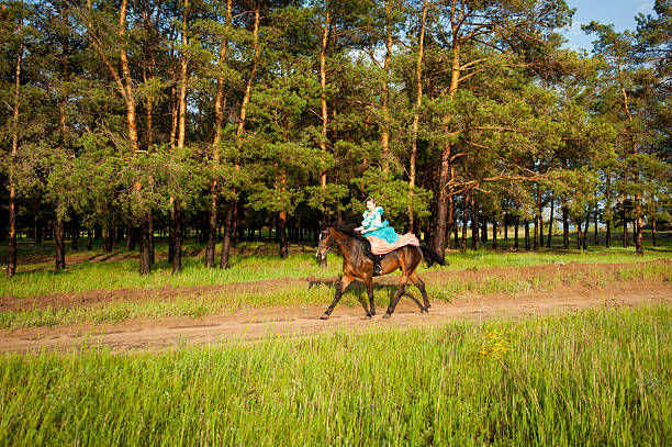 istock Horsewoman riding. 481757646