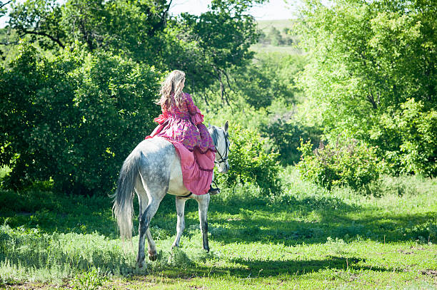 istock Horsewoman on white horse 481757672