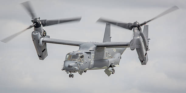 Fairford, UK - July 18, 2015: A V-22 Osprey tilt-rotor transport aircraft operated by the US Air Force in flight over Gloucestershire, England. 