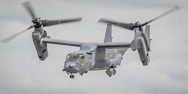 V-22 Osprey tilt-rotor aircraft, USAF Fairford, UK - July 18, 2015: A V-22 Osprey tilt-rotor transport aircraft operated by the US Air Force in flight over Gloucestershire, England.  tilt rotor stock pictures, royalty-free photos & images