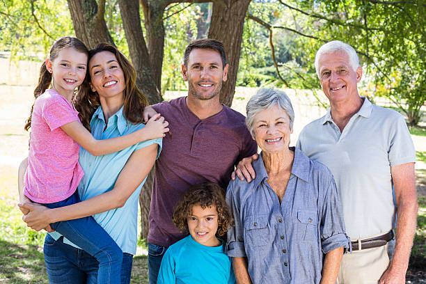 istock Extended family smiling in the park 481762244