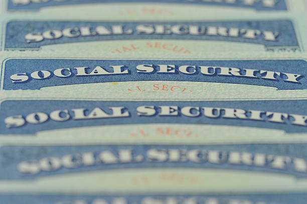 Social Security Cards Close-up of American Social Security cards. Selective focus, Blur. peace demonstration photos stock pictures, royalty-free photos & images