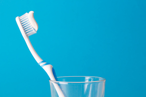 Toothbrushes on blue background.