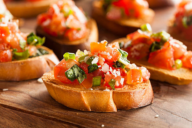 Homemade Italian Bruschetta Appetizer Homemade Italian Bruschetta Appetizer with Basil and Tomatoes bruschetta stock pictures, royalty-free photos & images