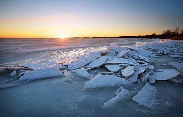 istock Winter landscape with frozen lake and sunset sky. 481765938