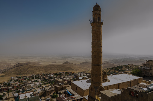 This captivating photograph transports viewers to the historical city of Uch Sharif, allowing them to marvel at its timeless beauty and rich cultural heritage. Nestled amidst a landscape of lush greenery, the city stands as a testament to centuries of history and civilization.\n\nThe image showcases a panoramic view of Uch Sharif, with its architectural treasures gracefully dotting the skyline. The ancient structures, bathed in warm sunlight, exude an aura of grandeur and mystique. The delicate minarets and intricately designed domes rise majestically against the clear blue sky, narrating tales of bygone eras.\n\nThe city's historic significance is evident in the intricate details that adorn its buildings. Ornate carvings, geometric patterns, and decorative motifs adorn the walls and facades, reflecting the artistic prowess of the craftsmen who brought these structures to life. Each element tells a story, inviting viewers to delve into the rich tapestry of Uch Sharif's past.\n\nThe image captures the essence of Uch Sharif's vibrant streets. In the foreground, locals and visitors meander through narrow lanes, adding a sense of life and movement to the scene. The city's bustling markets and colorful shops offer a glimpse into the daily lives of its inhabitants, bridging the gap between past and present.\n\nAs the sun casts a golden glow over the city, it casts gentle shadows, creating a play of light and shade that further enhances the historical ambiance. The tranquility of the surroundings allows viewers to pause and appreciate the serene beauty of Uch Sharif, transporting them to a different era.\n\nThis photograph encapsulates the allure of Uch Sharif, inviting viewers to embark on a visual journey through time. It serves as a reminder of the importance of preserving cultural heritage and cherishing the historical gems that continue to inspire and captivate generations.\n\nKeywords: