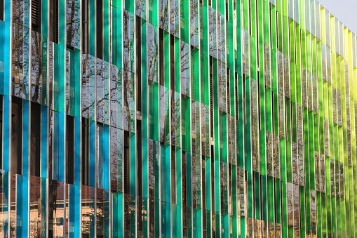 Public Office building with colorful graduated shading and reflexions in windows