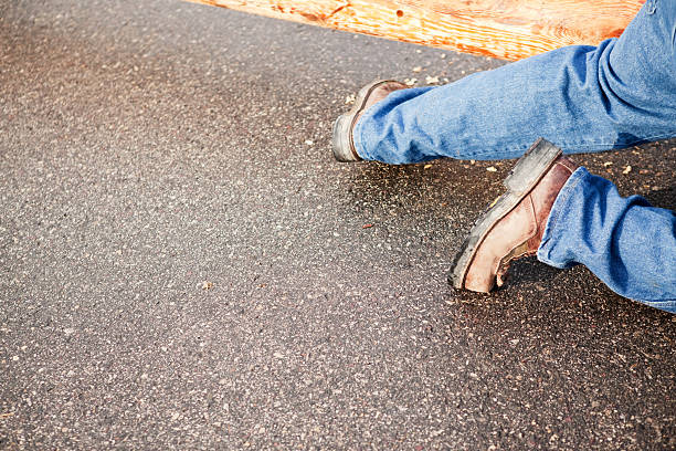 istock Utility Worker Steel Toe Boots on Asphalt Street 481774455