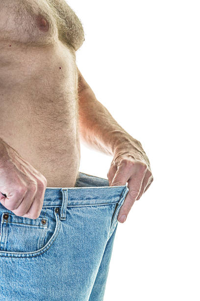 istock Shirtless Weight Loss Man With Large Jeans 481776600