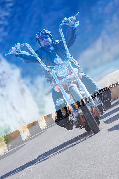 istock double exposure chopper motorcyclist and asphalt road 481779932